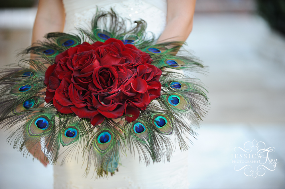Red rose and peacock feather bouquet