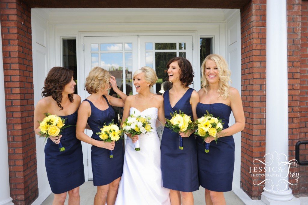 Navy blue bridesmaid dresses with yellow bouquets