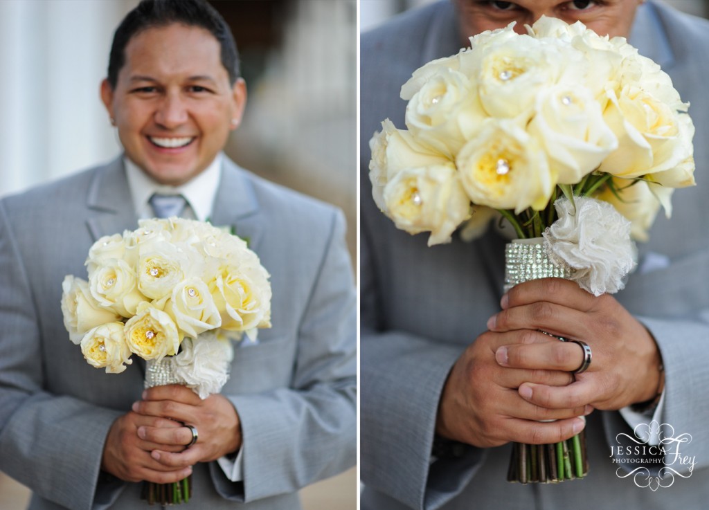 groom in grey suit with yellow roses