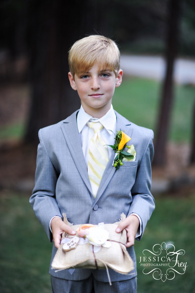 ring bearer in grey suit with yellow tie