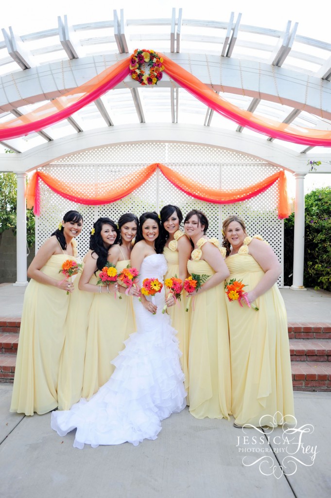 long yellow bridesmaid dress, pink and oragne bridesmaid bouquet