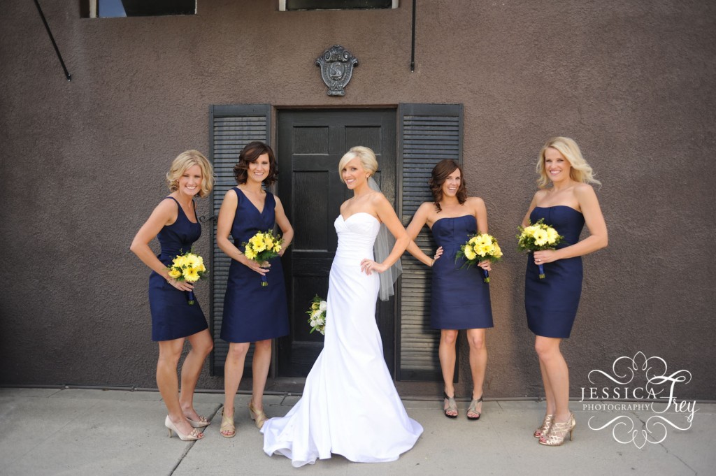 Short navy blue bridesmaid dresses J Crew with yellow gerber daisy 