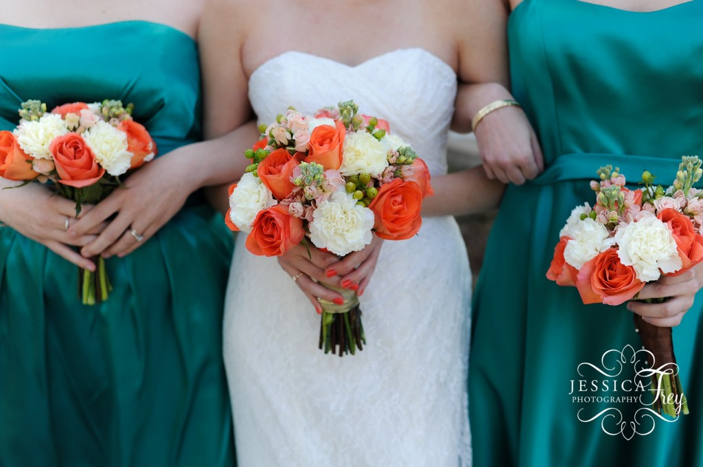 coral and white wedding bouquet, teal bridesmaid dress and coral bouquet
