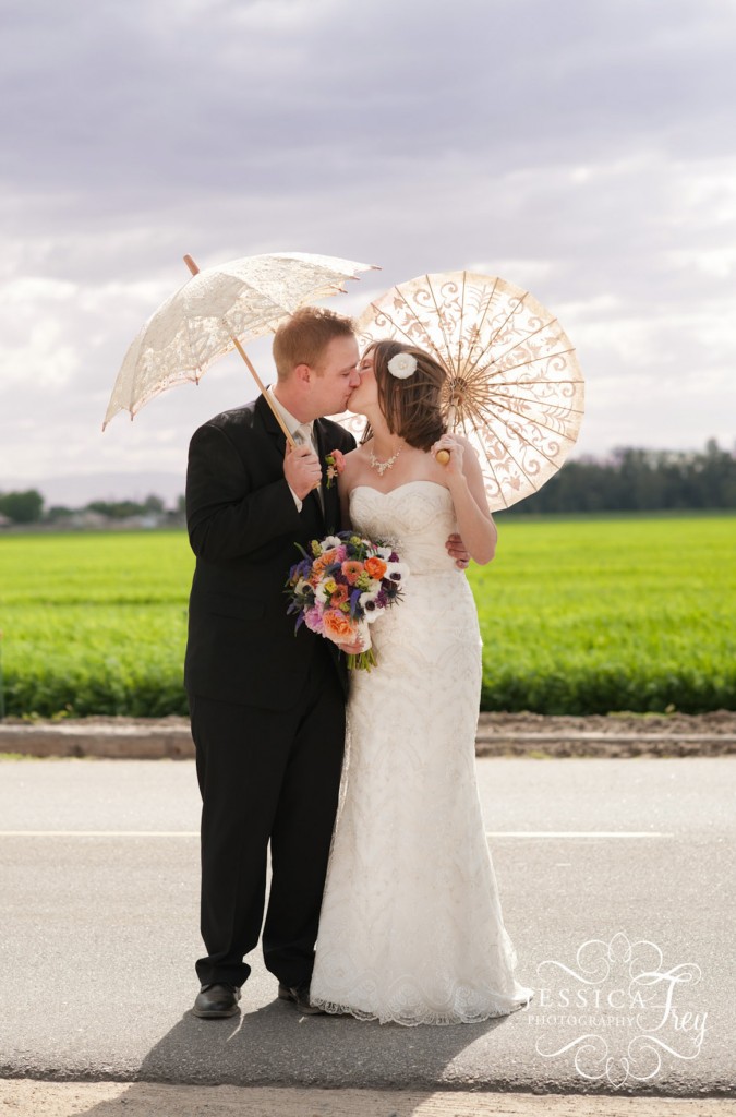 Jessica Frey Wedding Photography , bride and groom with parasols
