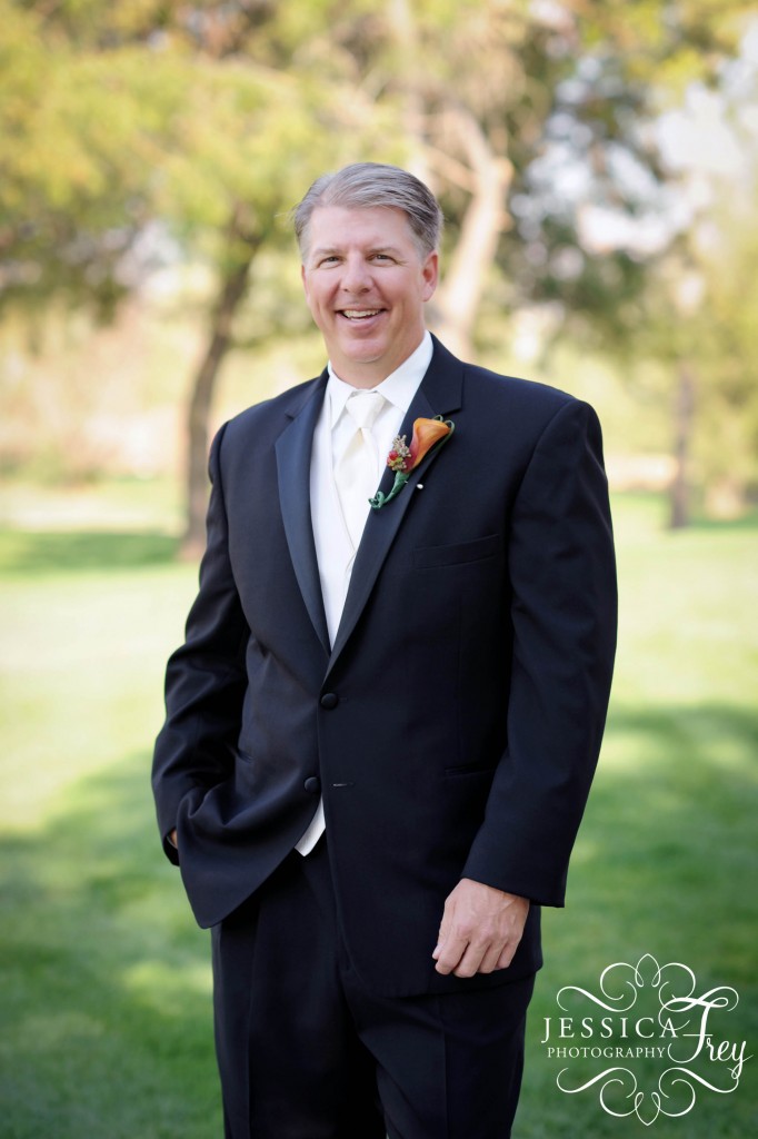 Jessica Frey Photography, groom's suit is black with pale yellow tie and orange calla lilly boutonniere 